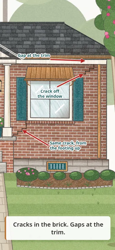 A crack in the brick runs off the window, with a gap at the trim.